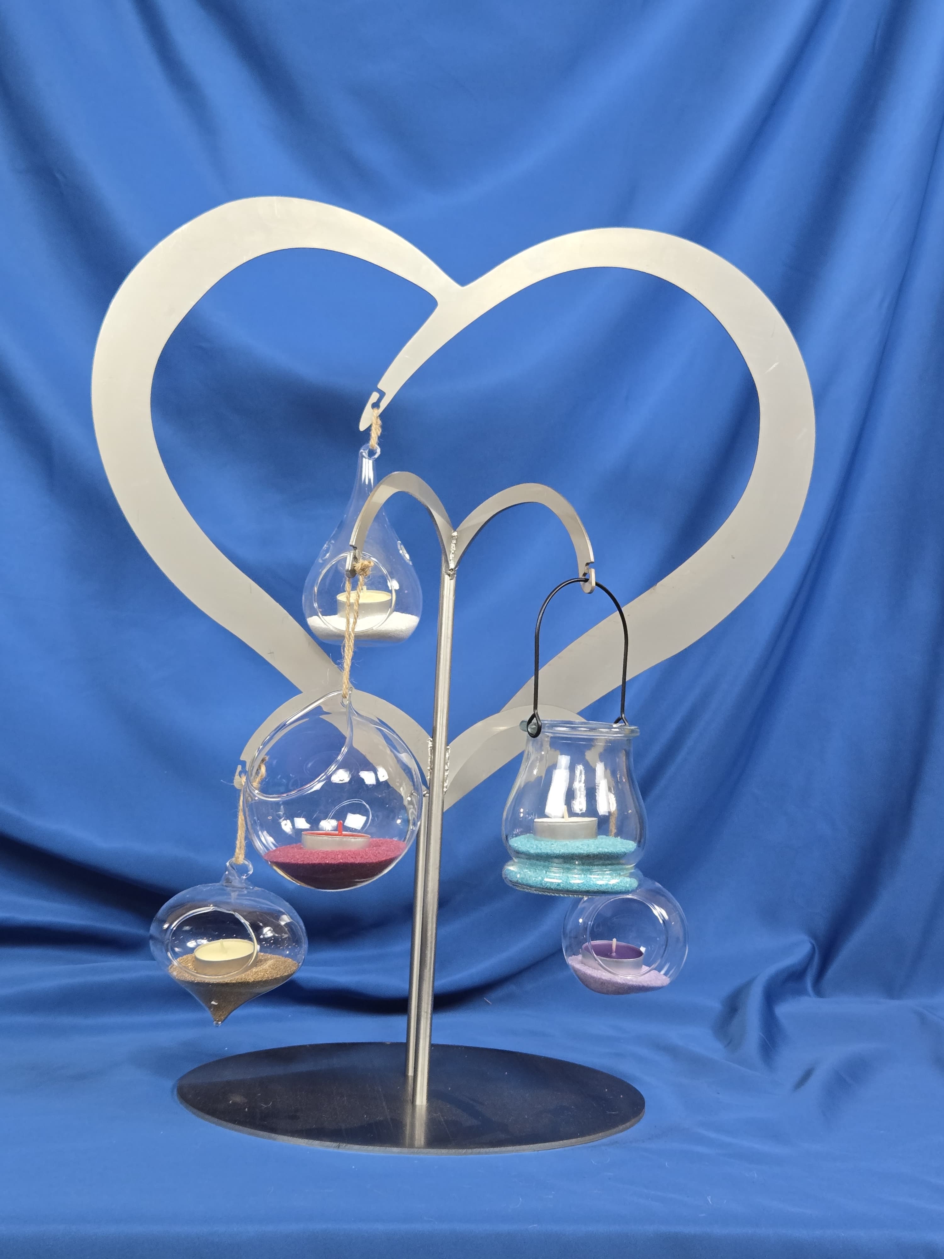 Glass tealight holder with coloured sand